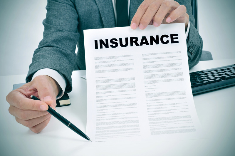 insurance agent presenting contract with Liability Insurance in Salt Lake City, Murray, Riverton, Sandy, West Valley City, UT