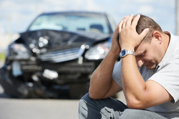 man with hands on head after car accident needs car insurance in Sandy, UT