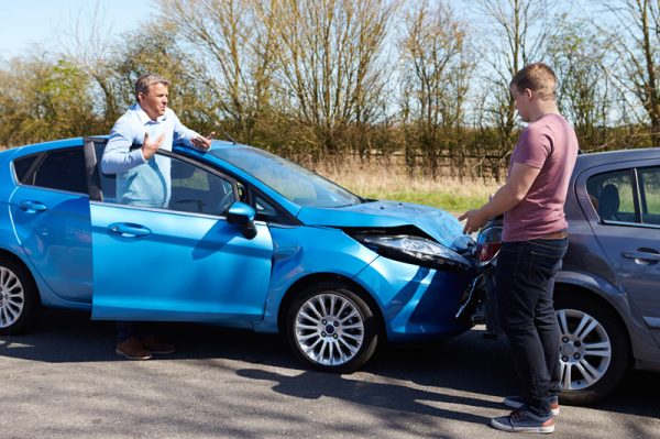 two people discuss car accident need car insurance in Murray, UT