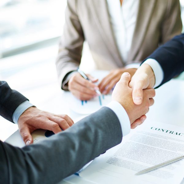 handshake after meeting discussing Liability Insurance in Sandy