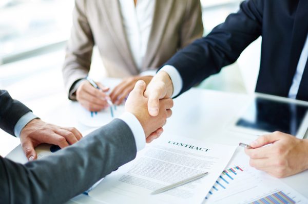 handshake of people meeting about car insurance in Riverton, UT